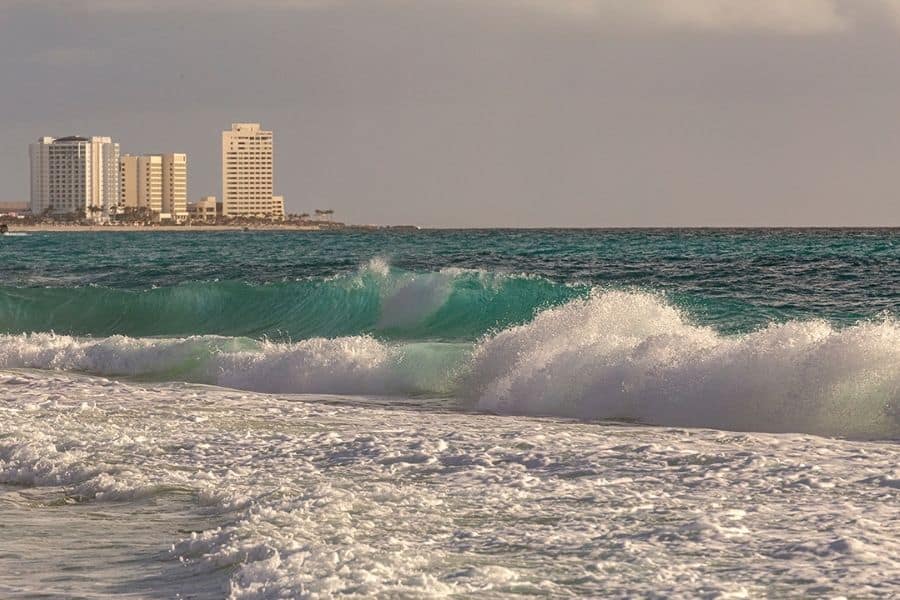 Cancun beach with buildings in the background
