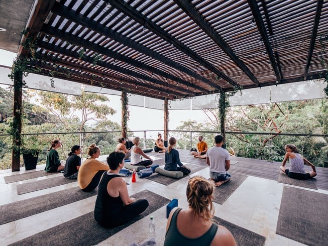 People doing yoga in a yoga shala
