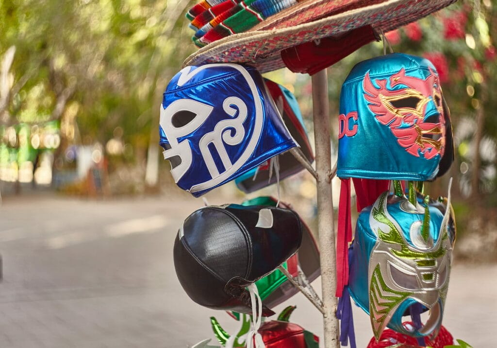 Masks on display on a pole.