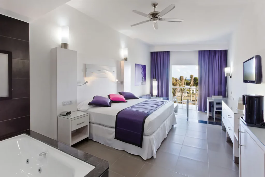 A cool hotel in Playa del Carmen with purple accent room.